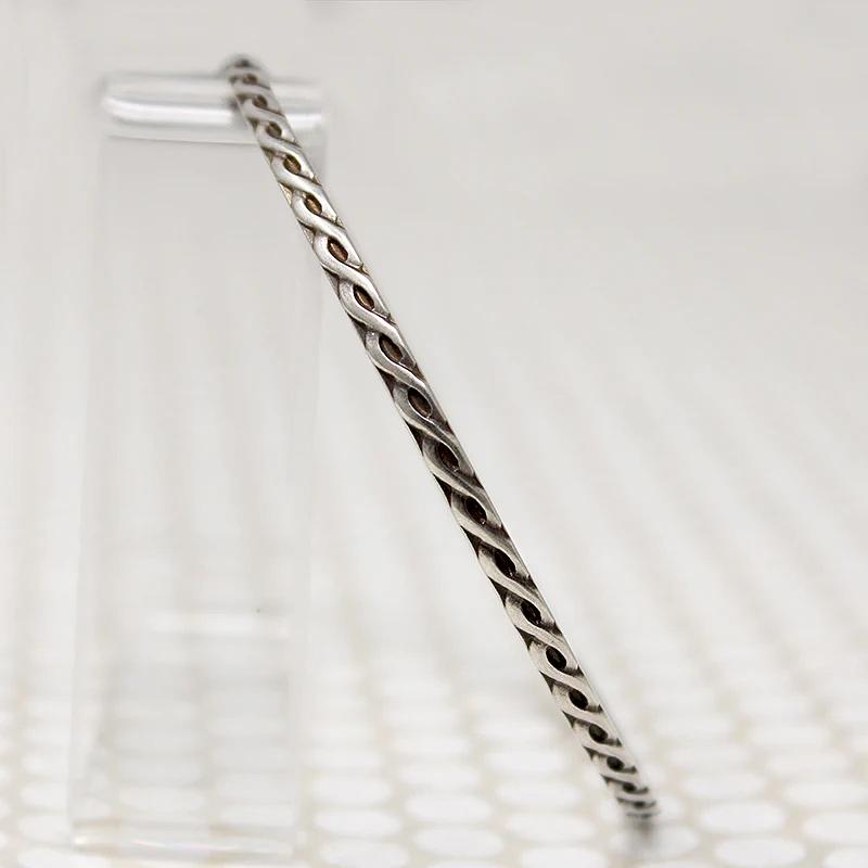 The Rope Twist Sterling Bangle from Allie B.