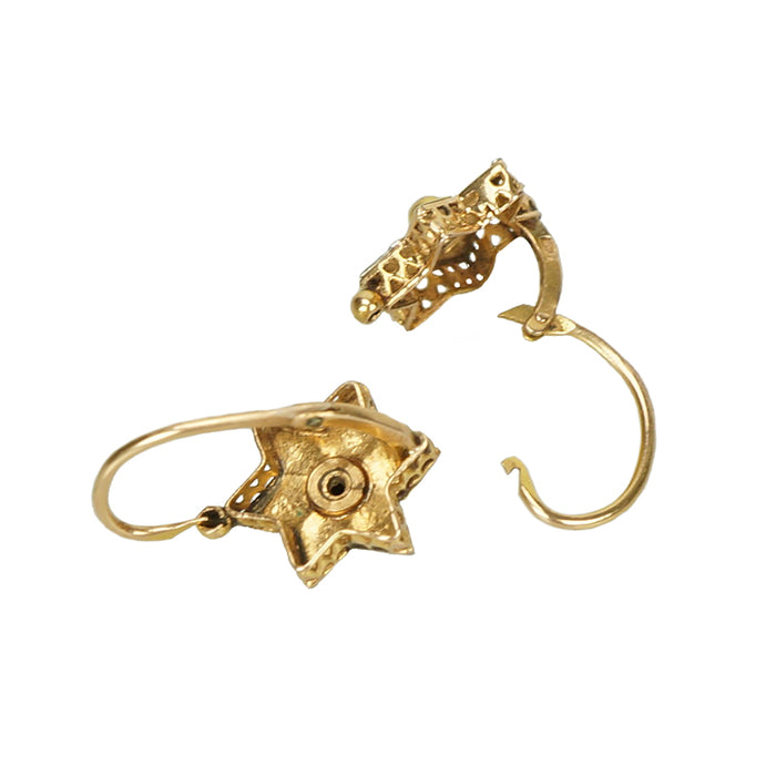 back and side detail of gold pinwheel shaped victorian small earrings