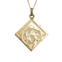 details of engraving on a victorian locket