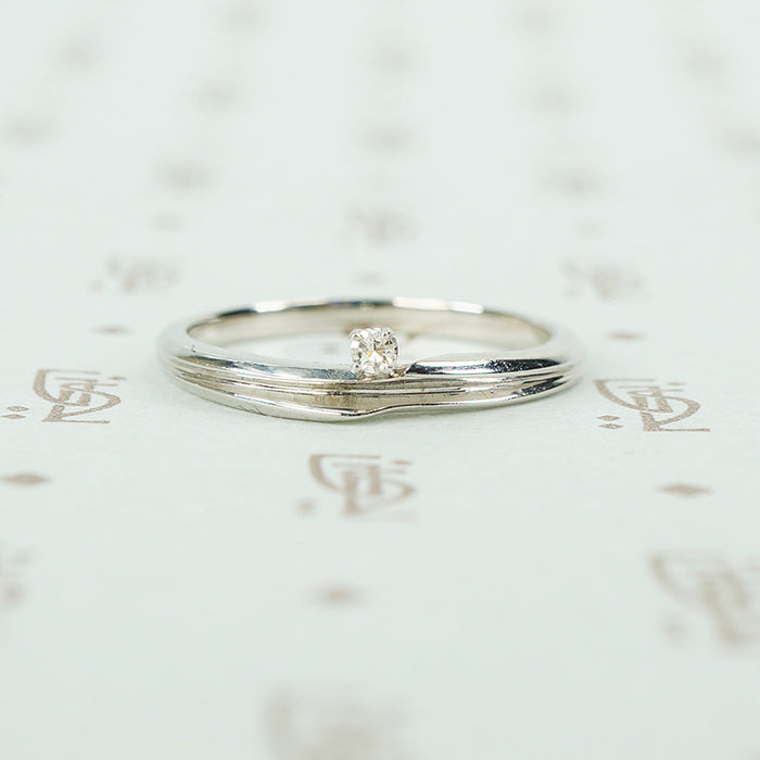 swirly white gold and diamond satelite ring