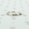swirly white gold and diamond satelite ring