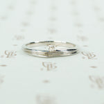 swirly white gold and diamond satelite ring