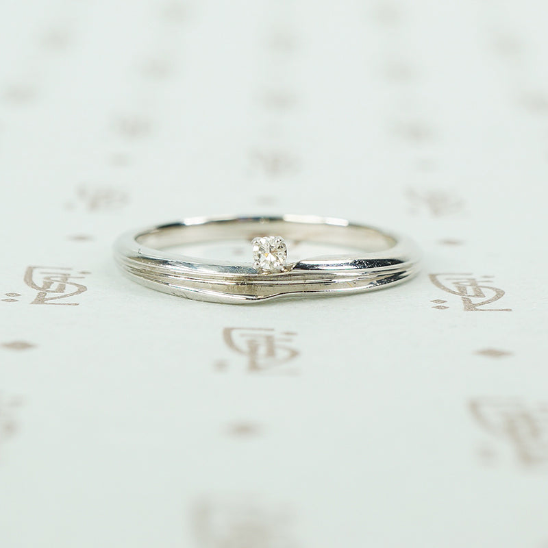 swirly white gold and diamond satelite ring