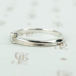 swirly white gold and diamond satelite ring side view