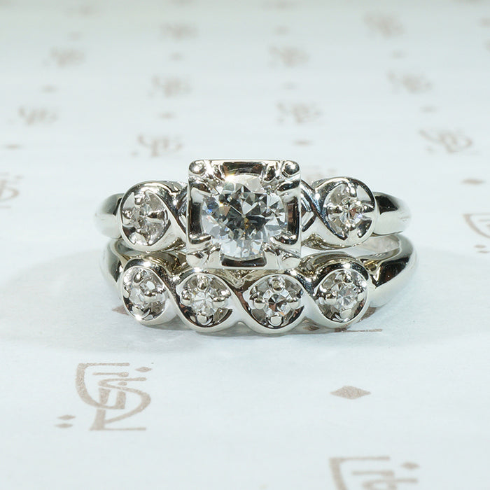 pretty 1950's vintage wedding set with oec center doamond and matching band