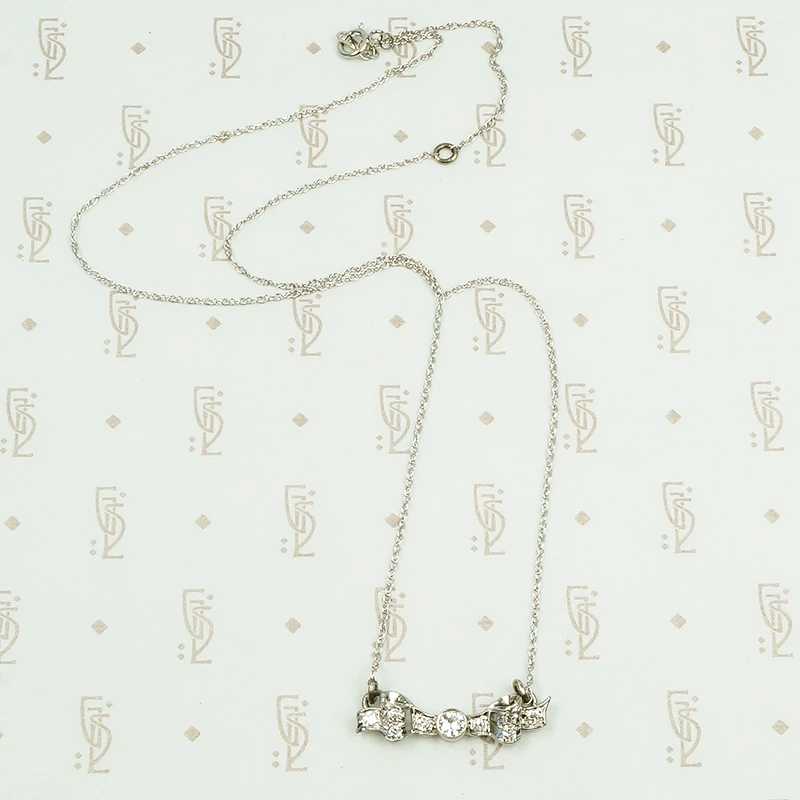vintage white gold and diamond bow necklace
