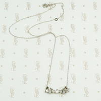 vintage white gold and diamond bow necklace