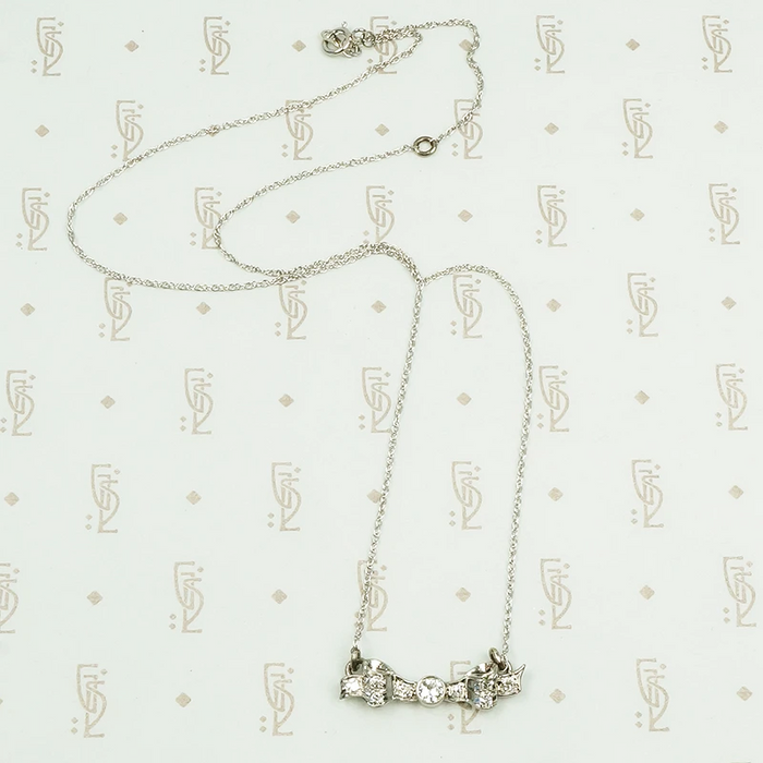 vintage white gold and diamond bow necklace