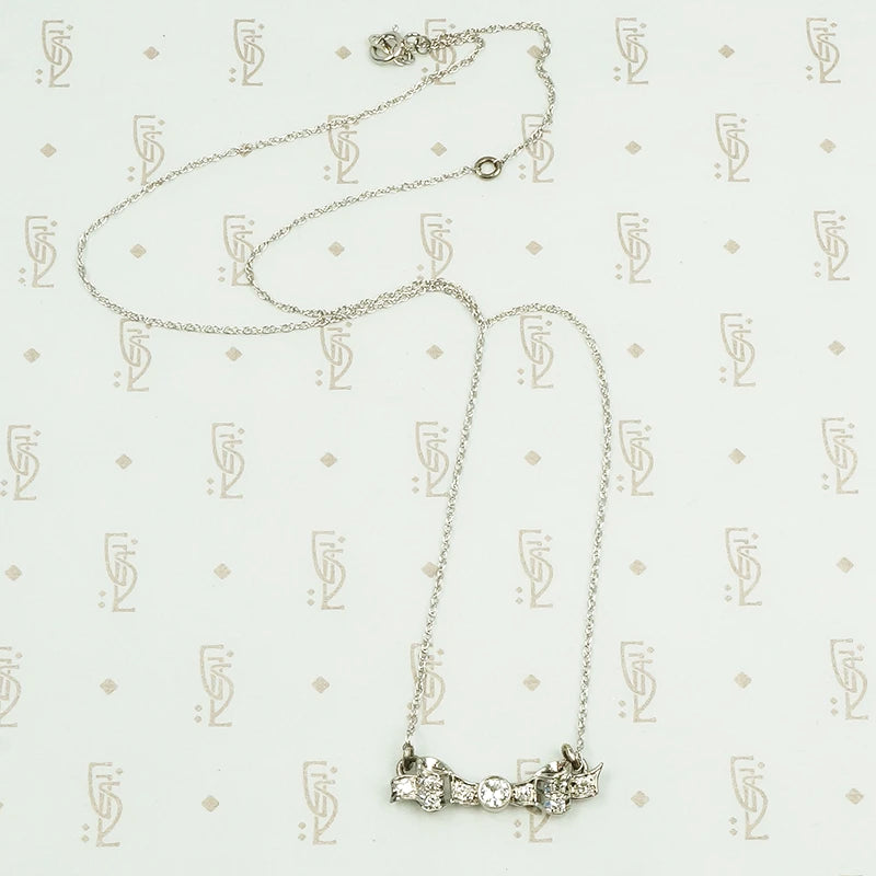 vintage white gold and diamond bow necklace
