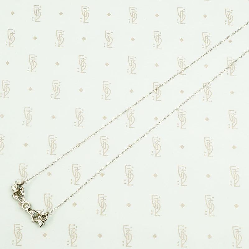vintage white gold and diamond bow necklace