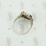 deco onyx and diamond ring in white gold filigree side view