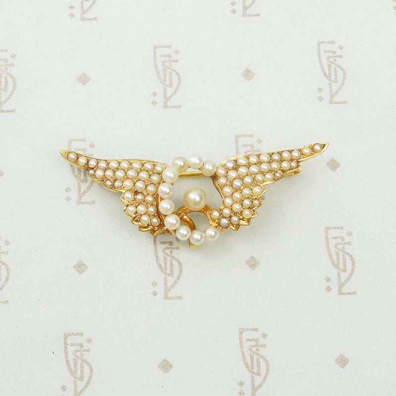 14k yellow gold and pearl chatelaine brooch winged wheel