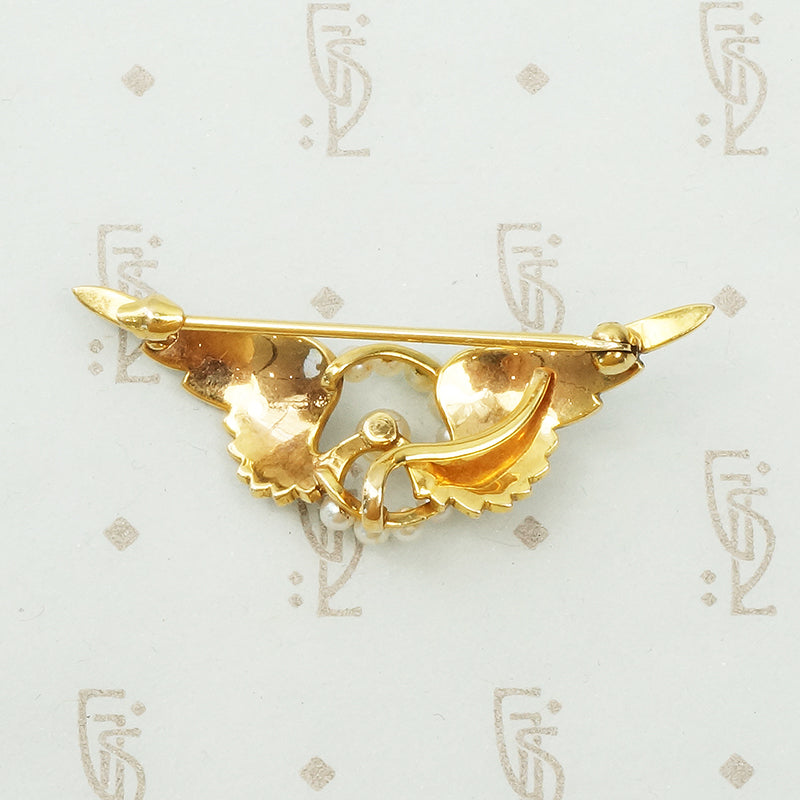 14k yellow gold and pearl chatelaine brooch winged wheel