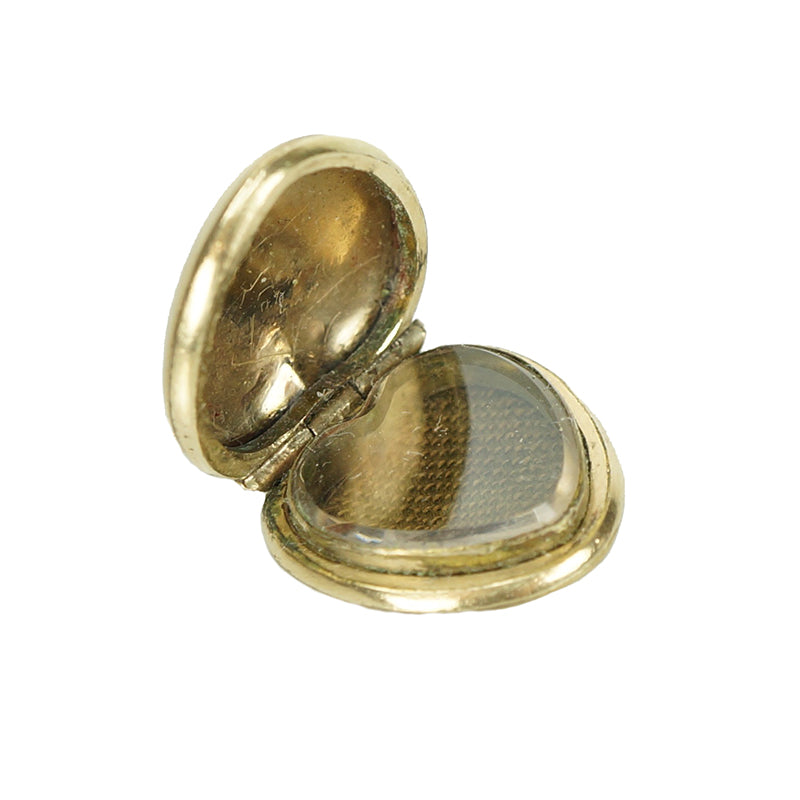 interior detail of antique gold locket hair reciever