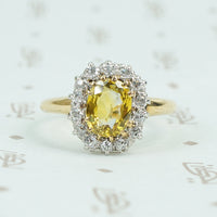 oval yellow sapphire in oec diamond halo ring