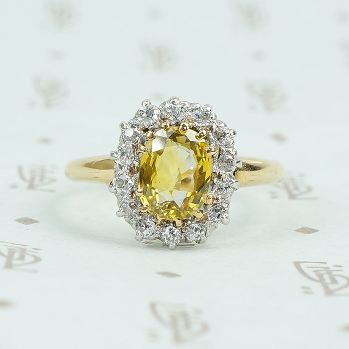 oval yellow sapphire in oec diamond halo ring