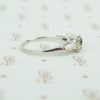 cushion cut yellow sapphire set in platinum with baguette diamond sides