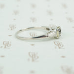cushion cut yellow sapphire set in platinum with baguette diamond sides