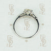 cushion cut yellow sapphire engagement ring set in platinum with baguette diamond sides