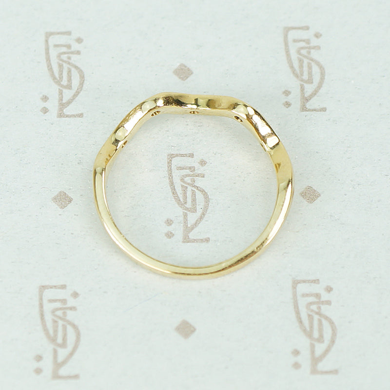 top side view of 14k recycled gold wave diamond band
