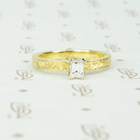 18k yellow gold and emerald cut diamond engagement ring