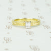 18k yellow gold and emerald cut diamond engagement ring
