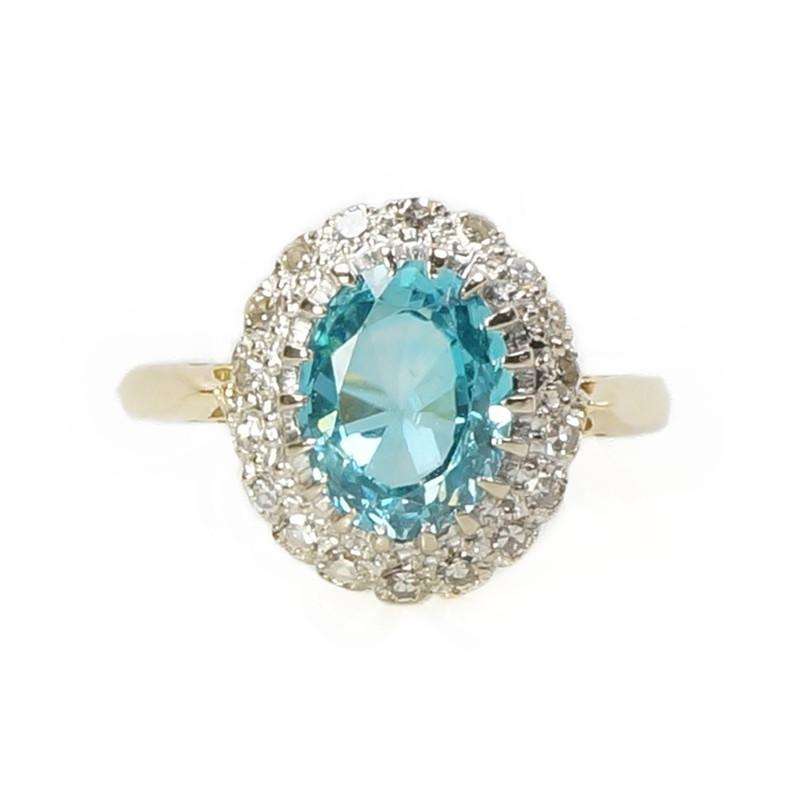 Stunning Natural Blue Zircon Surrounded by Diamonds in 18k Gold