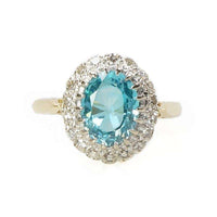 Stunning Natural Blue Zircon Surrounded by Diamonds in 18k Gold