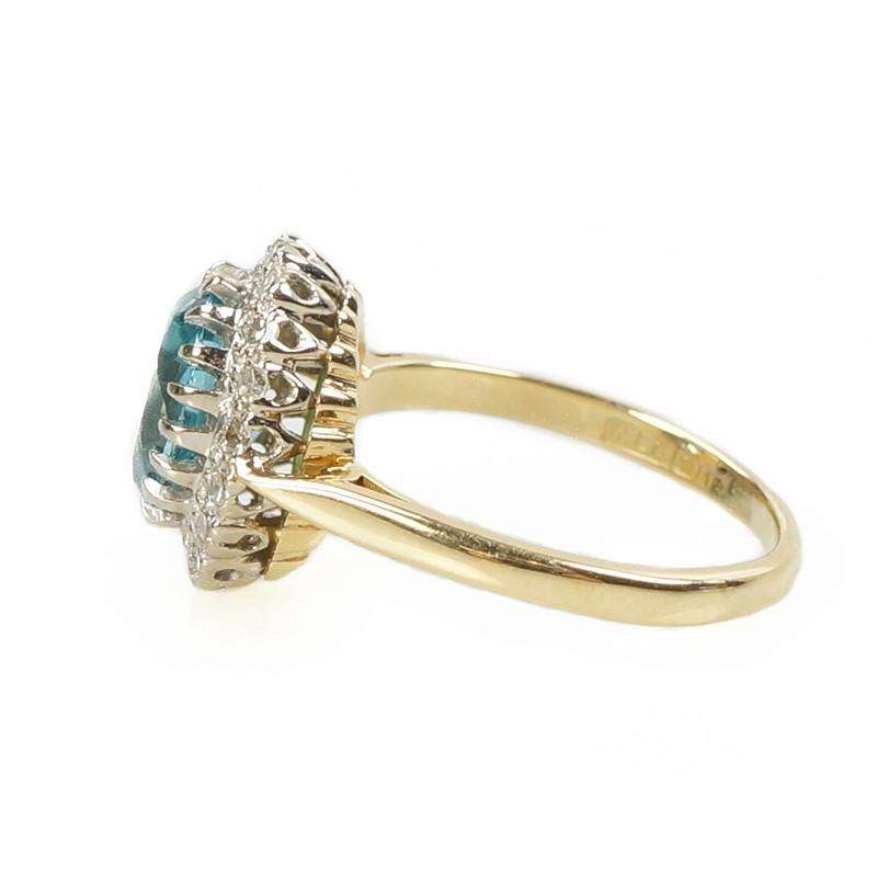 Stunning Natural Blue Zircon Surrounded by Diamonds in 18k Gold